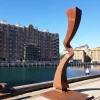 Deflect -corten steel tall outdoor sculpture